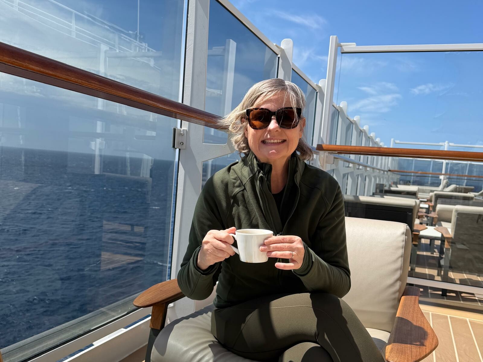 Gilly enjoying morning coffee onboard EXPLORA I