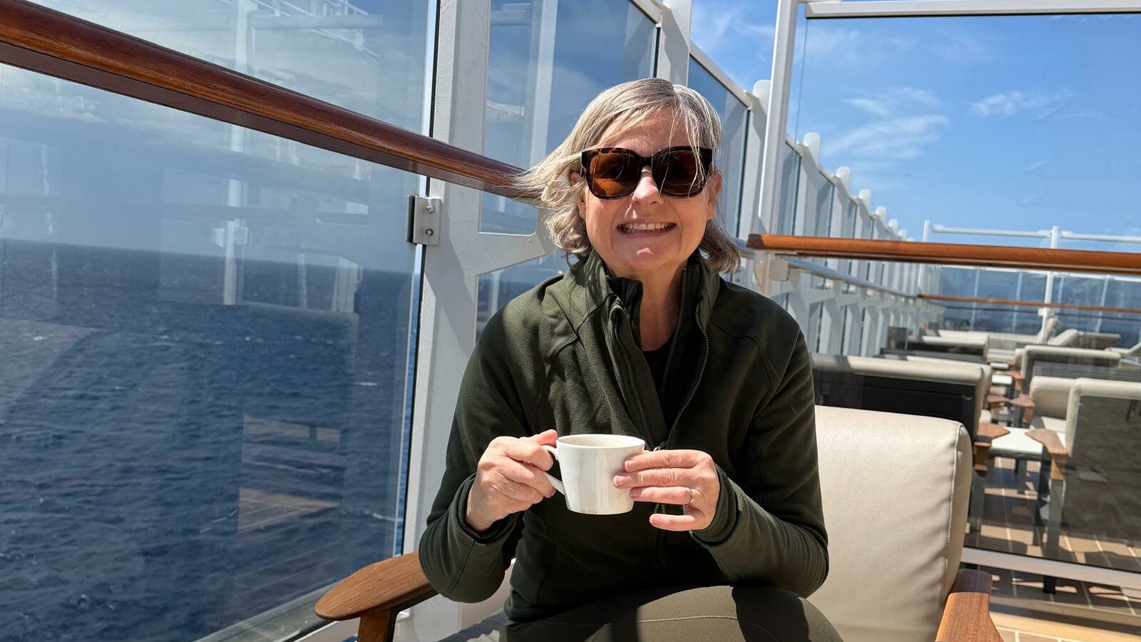 Gilly enjoying morning coffee onboard EXPLORA I